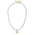 Gold Cross on Light Blue Beaded Necklace